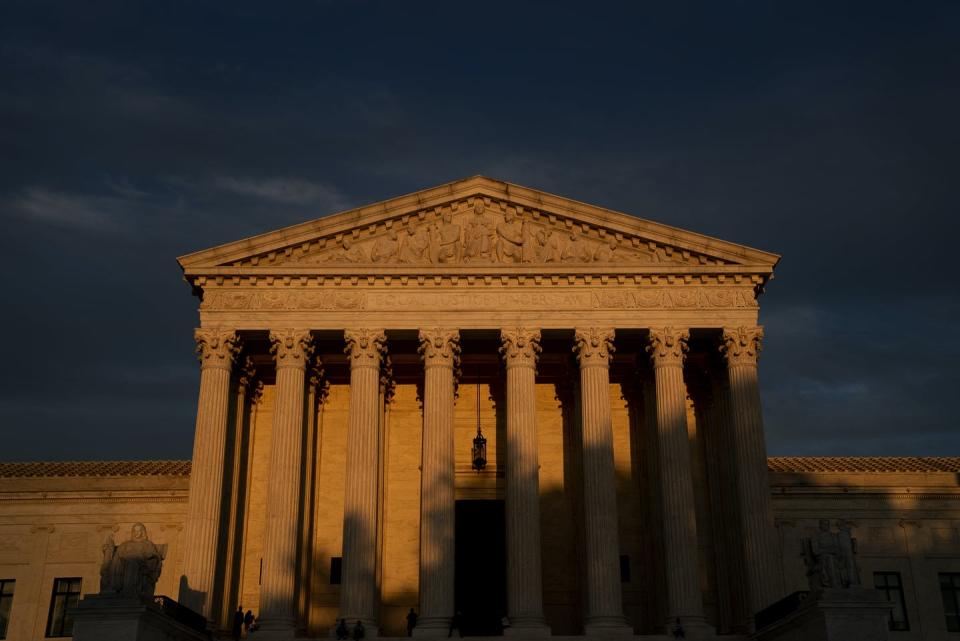 <span class="caption">The Supreme Court hears a case on Dec. 1, 2021, regarding a Mississippi abortion law that poses a legal challenge to Roe v. Wade. </span> <span class="attribution"><a class="link " href="https://www.gettyimages.com/detail/news-photo/the-u-s-supreme-court-on-september-25-2021-in-washington-dc-news-photo/1235502819?adppopup=true" rel="nofollow noopener" target="_blank" data-ylk="slk:(Photo by Stefani Reynolds/Getty Images;elm:context_link;itc:0;sec:content-canvas">(Photo by Stefani Reynolds/Getty Images</a></span>