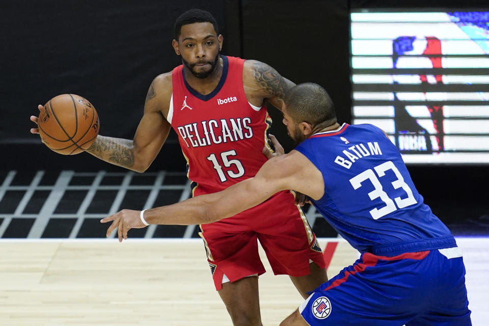 Los Angeles Clippers forward Nicolas Batum (33) defends against New Orleans Pelicans guard Sindarius Thornwell (15) during the first quarter of an NBA basketball game Wednesday, Jan. 13, 2021, in Los Angeles. (AP Photo/Ashley Landis)