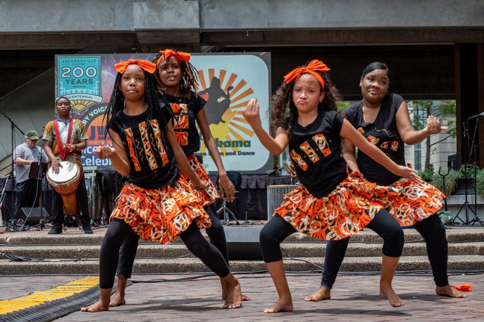 The Nan Nkana Pan African Drum and Dance troupe entertainws the crowd at James Weldon Johnson Park during Jacksonville's Bicentennial celebration downtown on Saturday.