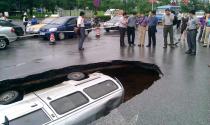 A van driver got the shock of his life when the road suddenly caved in beneath him. The vehicle was seen suddenly disappearing down a newly-formed giant sinkhole on a road in the city of Guilin, southern China. Experts said the cave-in was due to the local geology of the area.
