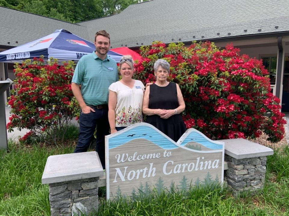 Blue Ridge Music Trails' Brandon Johnson and Donna Ray Norton stand with Pat Franklin, director of The Depot in Marshall.