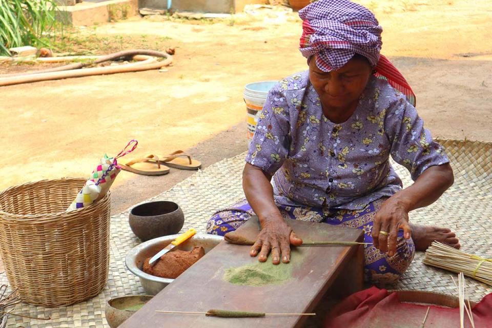 phnom penh cambodia - lady making incense