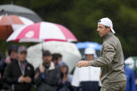 Rory McIlroy, of Northern Ireland, waves after his putt on the second hole during the third round of the PGA Championship golf tournament at Oak Hill Country Club on Saturday, May 20, 2023, in Pittsford, N.Y. (AP Photo/Seth Wenig)