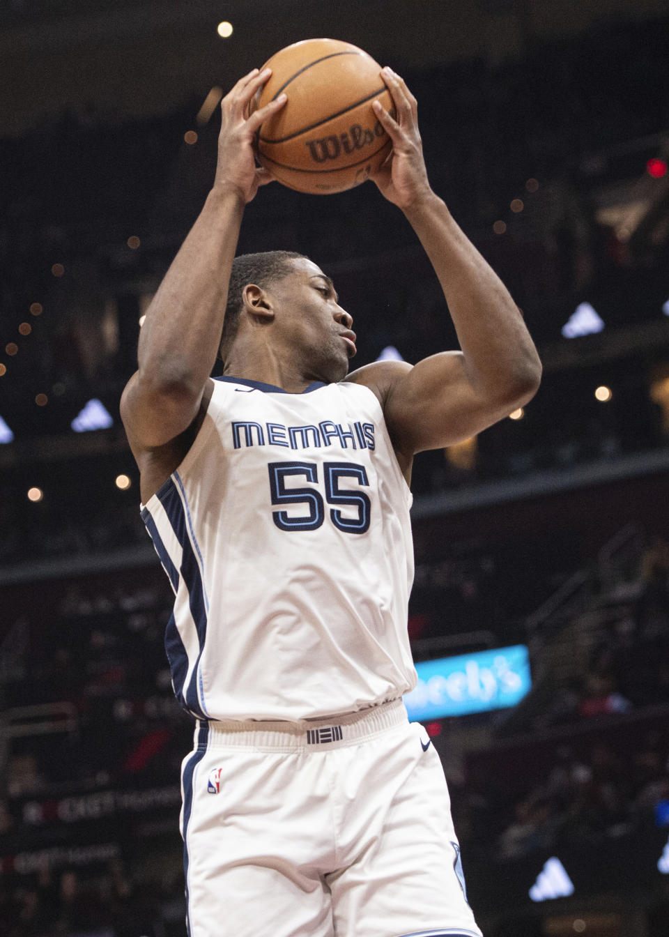 Memphis Grizzlies' Trey Jemison (55) grabs a rebound during the first half of an NBA basketball game against the Cleveland Cavaliers in Cleveland, Wednesday, April 10, 2024. (AP Photo/Phil Long)