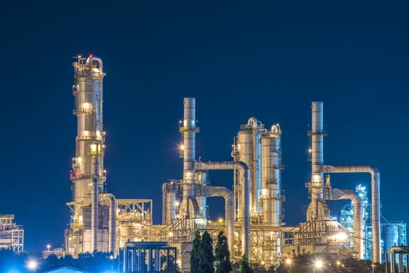 Oil refinery against dark blue sky