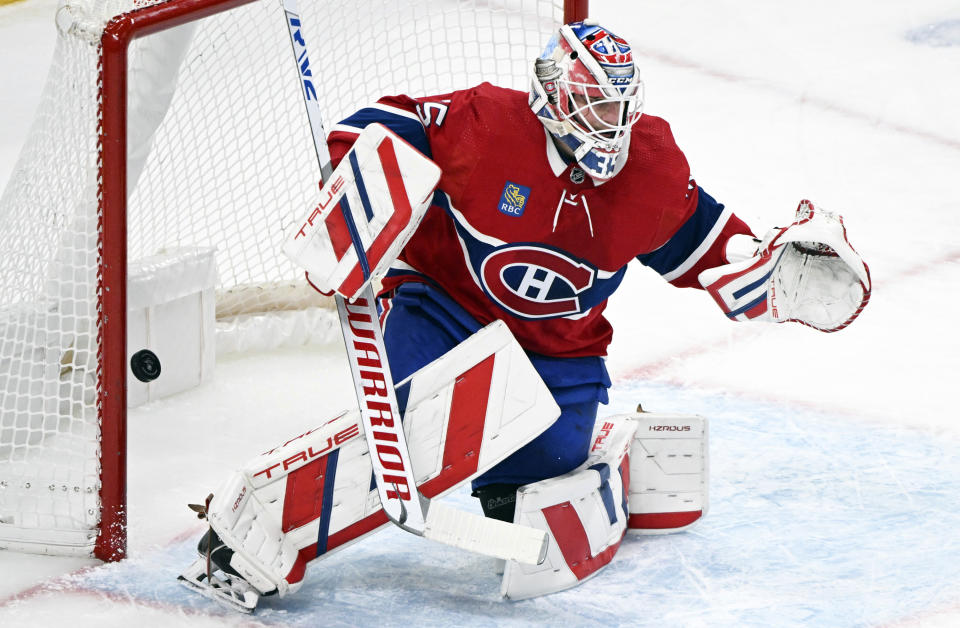 Montreal Canadiens goaltender Sam Montembeault is scored on by New York Rangers' Vincent Trocheck during the second period of an NHL hockey game, Saturday, Jan. 6, 2024 in Montreal. (Graham Hughes/The Canadian Press via AP)