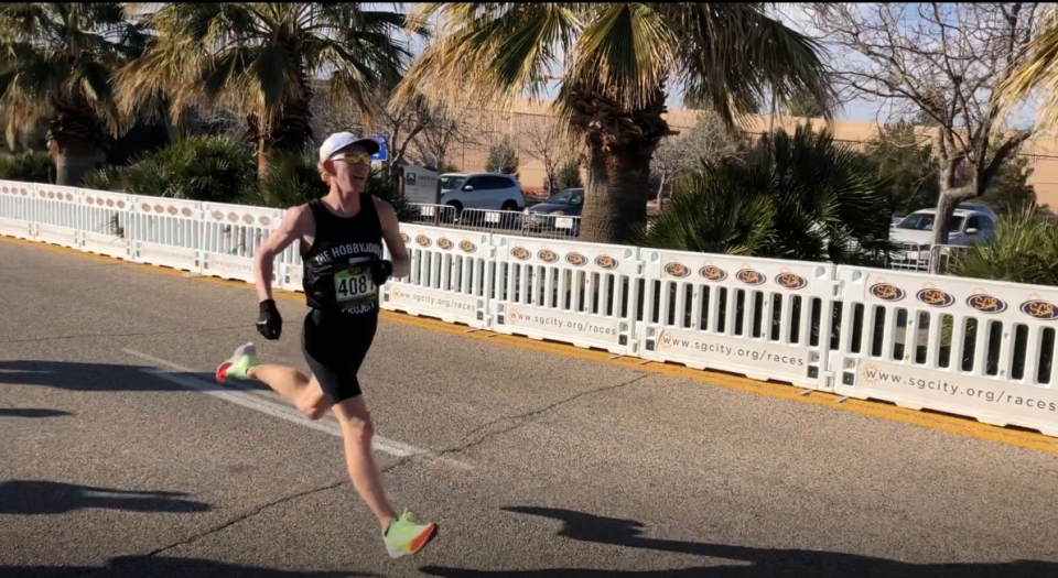 Eric Nelson streaks for the finish line to win the 2022 St. George Half-Marathon.