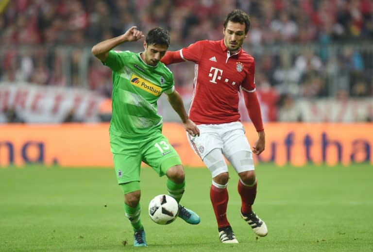 Bayern Munich's defender Mats Hummels (R) and Moenchengladbach's striker Lars Stindl fight for the ball on October 22, 2016