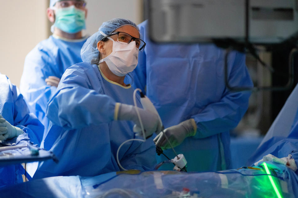 Dr. Nicole Turgeon gets ready to remove a healthy kidney from donor Kayla Wright on Feb. 22. The kidney was transplanted into Wright's cousin Dom Rainelli.