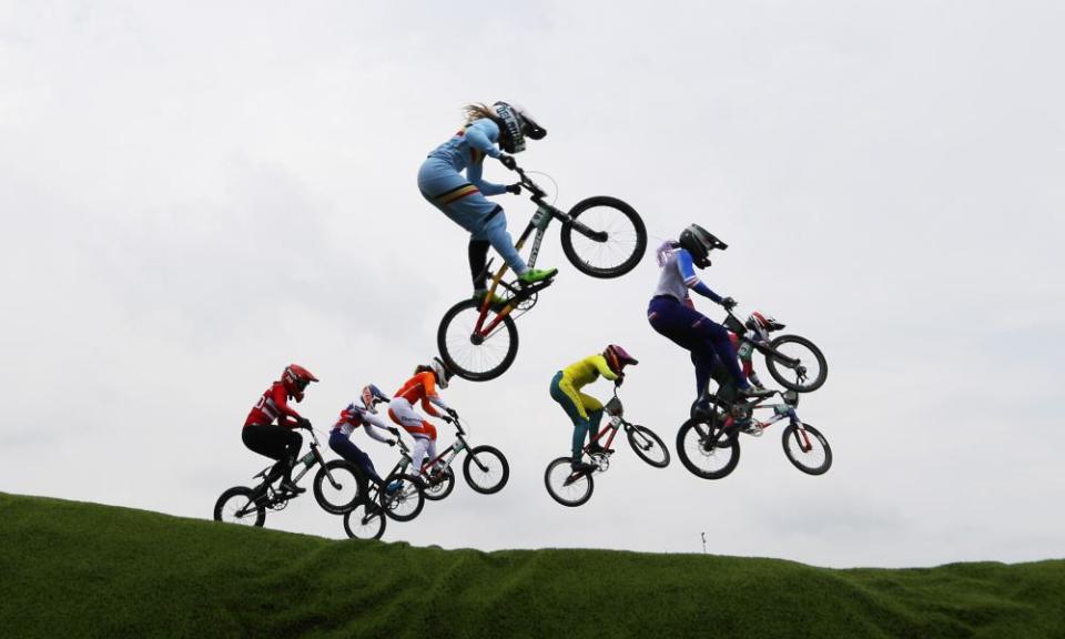 BMX bikers including eventual gold-medalist Bethany Shriever take a jump during one of the BMX semi-finals.