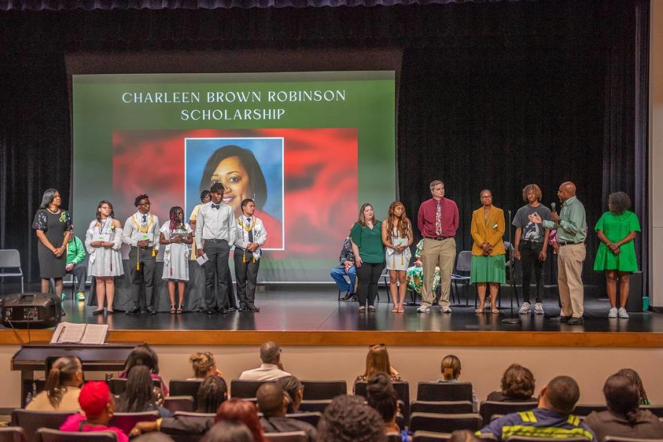 Retired Spencer High School principal Johnny Freeman speaks about the Charleen Brown Robinson Scholarship and the Alexis McRae Scholarship he established and funded for six recipients during the senior class awards ceremony May 8, 2024, in the Spencer auditorium.