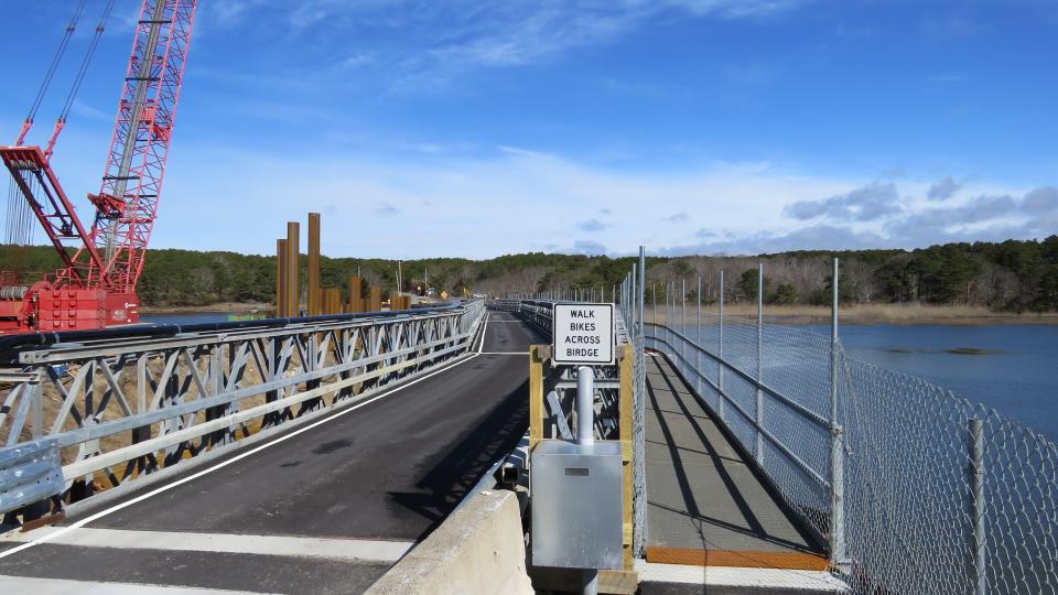 Wellfleet's new temporary bridge spans the Herring River and features a vehicle lane and a designated lane for bicyclists and pedestrians.