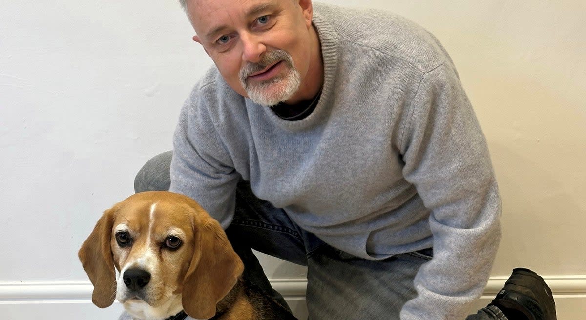 Brian Flynn with Flash the Beagle at home in Faversham, Kent (Brian Flynn / SWNS)