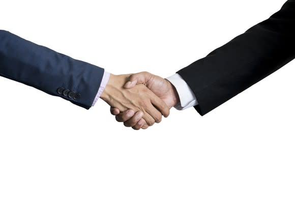 Two businessmen shaking hands.