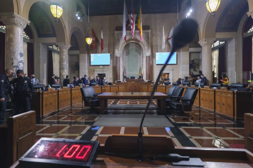 Los Angeles City Council members wait to start the Los Angeles City Council meeting Wednesday, Oct. 12, 2022 in Los Angeles. (AP Photo/Ringo H.W. Chiu)