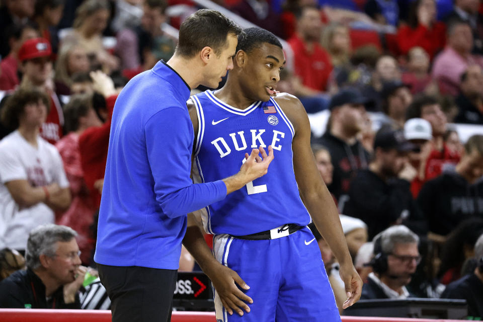 Duke coach Jon Scheyer talks with Jaylen Blakes during the second half of the team's NCAA college basketball game against North Carolina State in Raleigh, N.C., Wednesday, Jan. 4, 2023. (AP Photo/Karl B DeBlaker)