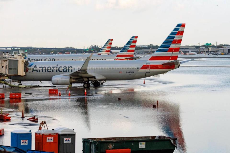 American Airlines airplanes at their terminal as the runway remains flooded from heavy rain at Fort Lauderdale-Hollywood International Airport on Thursday, April 13, 2023.