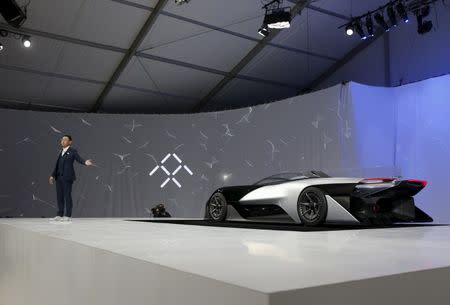 Richard Kim, head of global design for Faraday Future, stands by the Faraday Future FFZERO1 electric concept car after an unveiling at a news conference in Las Vegas, Nevada January 4, 2016. REUTERS/Steve Marcus