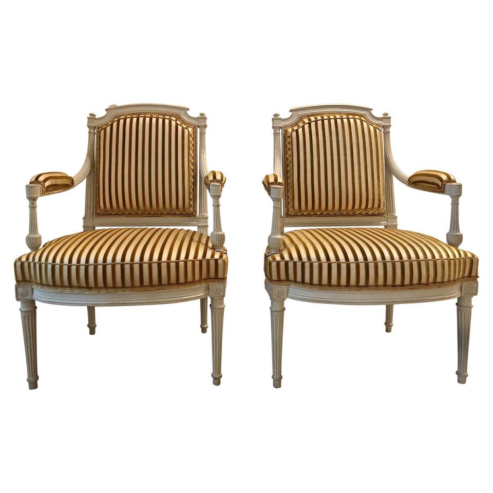 These two upholstered fauteuils cost $12,995.