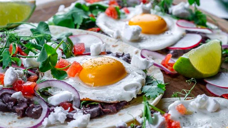 A lavish breakfast spread featuring Yo Egg's upcoming sunny side up plant-based eggs.