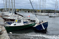 <p>A sailboat lies washed up next to a small craft following the passing of Hurricane Fiona, later downgraded to a post-tropical storm, in Shearwater, N.S. on Sept. 24, 2022. (REUTERS/Eric Martyn)</p> 