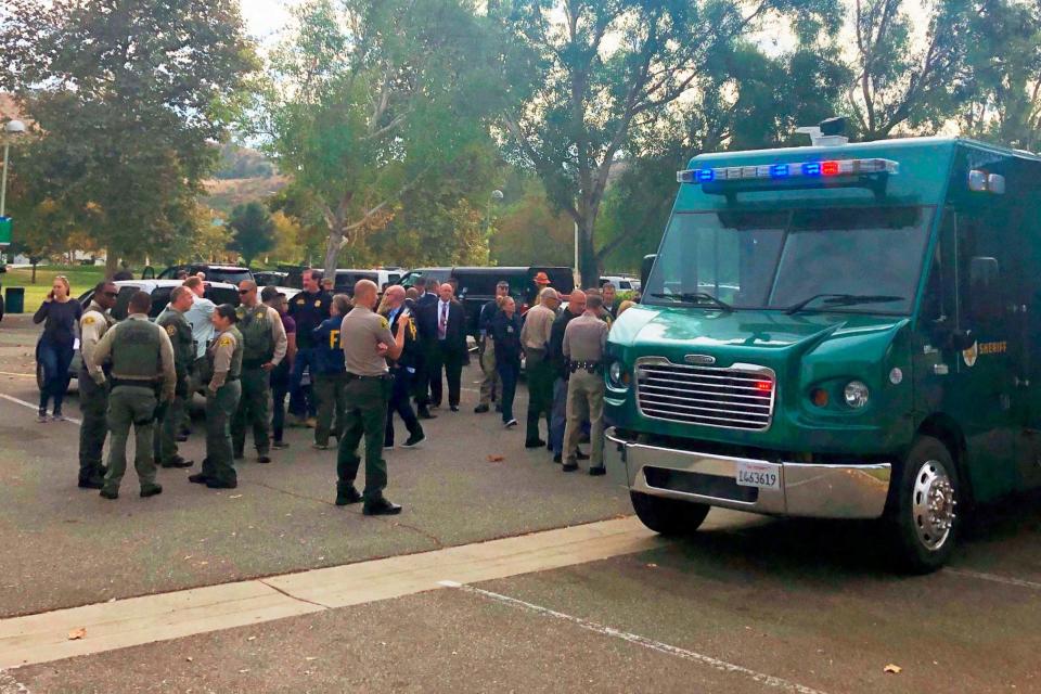 Law enforcement personnel gather outside Saugus High School (AP)