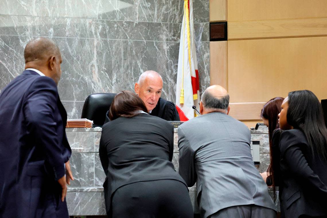 Judge John Murphy speaks with attorneys during a sidebar discussion during closing arguments in the trial of Jamell Demons, better known as rapper YNW Melly, at the Broward County Courthouse in Fort Lauderdale on Thursday, July 20, 2023. Demons, 22, is accused of killing two fellow rappers and conspiring to make it look like a drive-by shooting in October 2018. (Amy Beth Bennett / South Florida Sun Sentinel)