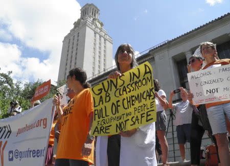 Members of the University of Texas of the Guns Free UT group that includes faculty and staff protest against a state law that allows for guns in classrooms at college campuses, in Austin, Texas, U.S. August 24, 2016. REUTERS/Jon Herskovitz