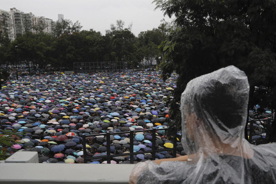 Protesters gather in Hong Kong Sunday, Aug. 18, 2019. Thousands of people streamed into a park in central Hong Kong for what organizers hope will be a peaceful demonstration for democracy in the semi-autonomous Chinese territory. (AP Photo/Kin Cheung)