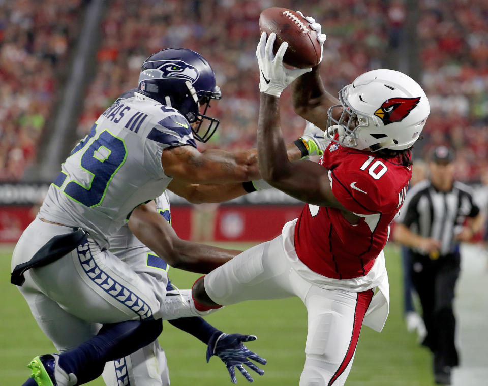 Seattle Seahawks safety Earl Thomas (29) was injured defending a touchdown pass to Arizona’s Chad Williams. (AP)