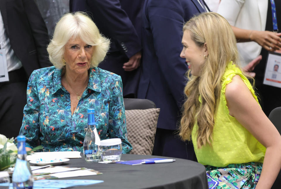 KIGALI, RWANDA - JUNE 23: Camilla, Duchess of Cornwall and Carrie Johnson, wife of Prime Minister Boris Johnson speak as they attend a Violence Against Women and Girls event at the Kigali Convention Centre on June 23, 2022 in Kigali, Rwanda. Prince Charles, Prince of Wales has attended five of the 24 Commonwealth Heads of Government Meeting meetings held since 1971: Edinburgh in 1997, Uganda in 2007, Sri Lanka in 2013 (representing The Queen), Malta in 2015 and the UK in 2018. It was during the UK CHOGM that it was formally announced that The Prince would succeed The Queen as Head of the Commonwealth. Leaders of Commonwealth countries meet every two years for the meeting which is hosted by a different member country on a rotating basis. (Photo by Chris Jackson/Getty Images)