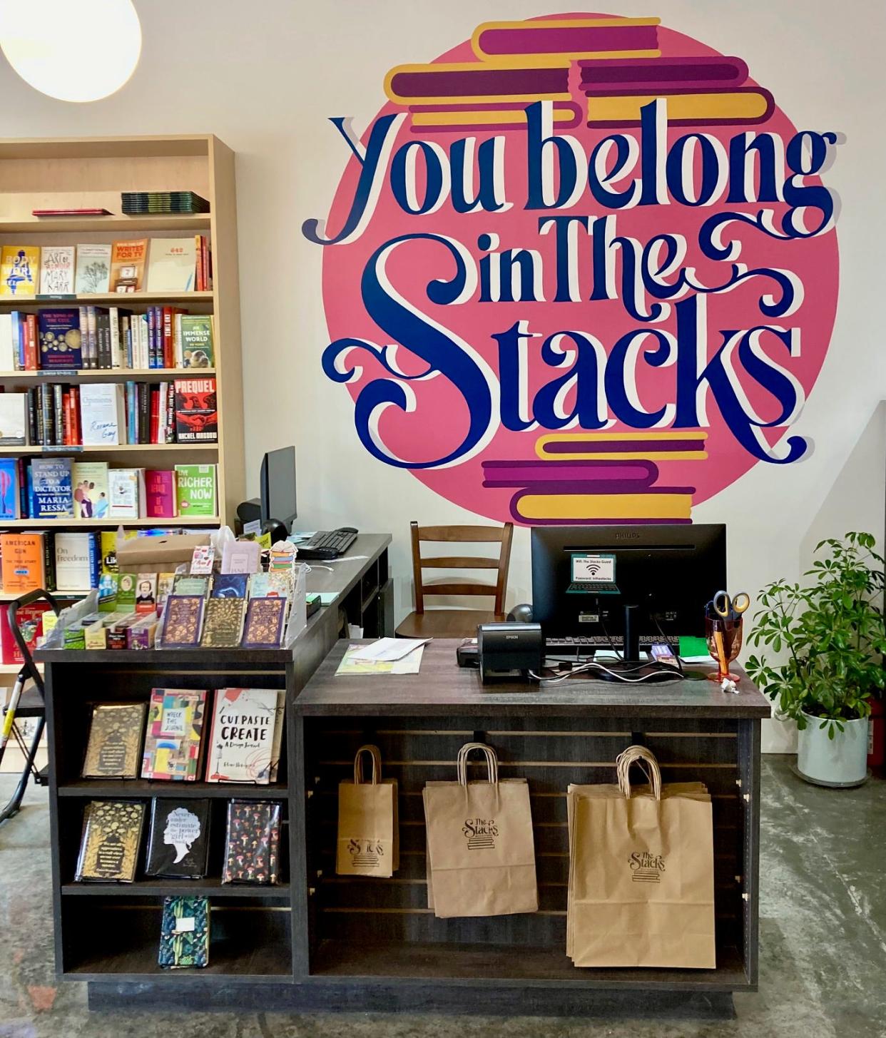 Bright mural welcoming all readers and writers to The Stacks.