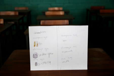 A drawing made during a lesson at a school shows what a student ate during the course of a day in Caracas, Venezuela July 14, 2016. The student wrote, "Today and yesterday I ate bread for breakfast; yesterday I had sardine with yucca, butter and water for lunch and had nothing for dinner." The student said that lasagna and cake were their favourite food. Picture taken July 14, 2016. REUTERS/Carlos Jasso