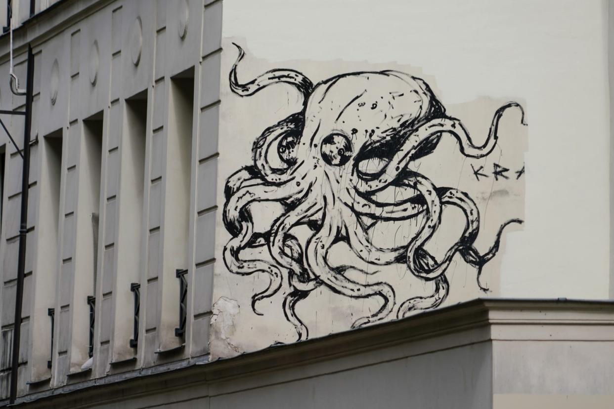 Street art graffiti depicting a giant octopus by artist Kraken