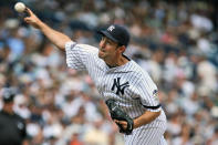 FILE - In this Aug. 17, 2008, file photo, New York Yankees' Mike Mussina pitches during the sixth inning of a baseball game against the Kansas City Royals at Yankee Stadium in New York. Mussina will be inducted into the Baseball Hall of Fame on Sunday, July 21, 2019. (AP Photo/Seth Wenig)