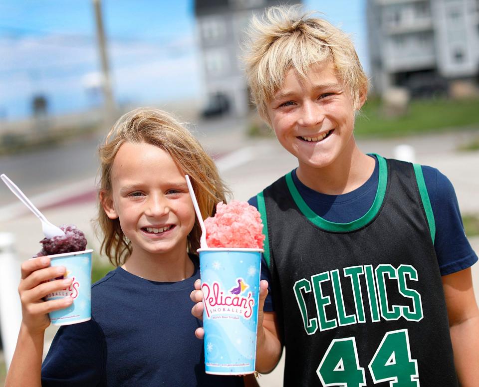 Brothers Matty Hall, 9, and Ben, 15, with Pelican's SnoBalls shaved ice Thursday, Aug. 18, 2022.