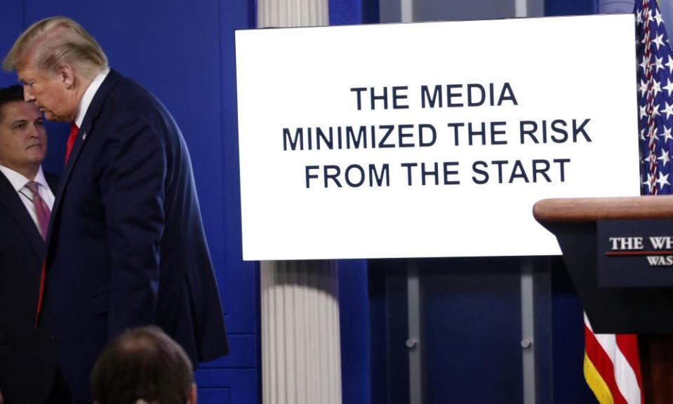 Donald Trump walks from the podium as a White House produced video plays during a briefing about the coronavirus on 13 April.