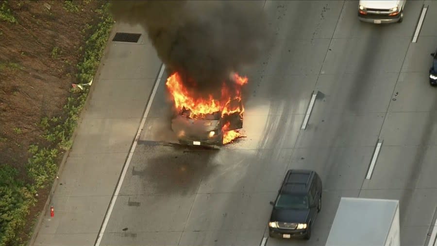 A burning van on the 105 Freeway in the City of Paramount caused delays for commuters early Monday morning. (Sky5)