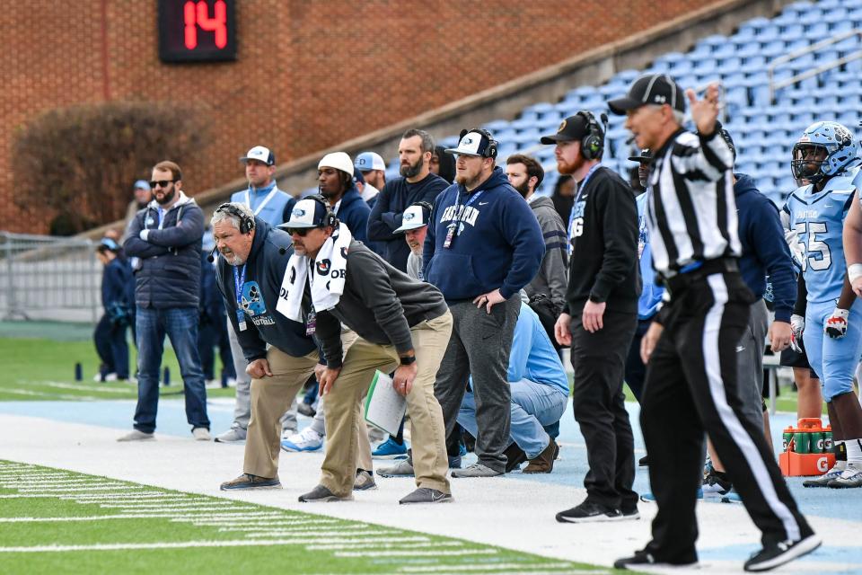 East Duplin head coach Battle Holley and assistant coach Brian Aldridge look on Saturday in the NCHSAA 2-A championship game.