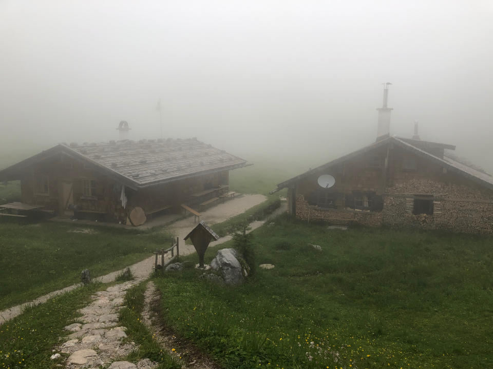 Fog surrounds the Wasseralm in der Röth, located in the Hagen Mountains of Berchtesgaden National Park on June 28, 2022. Many of the huts in the Berchtesgaden National Park, and throughout the Alps of Germany, Italy, Austria, and Switzerland, are serious concrete-and-steel-girder structures, built to stand year-round. (AP Photo/Mike Eckel)