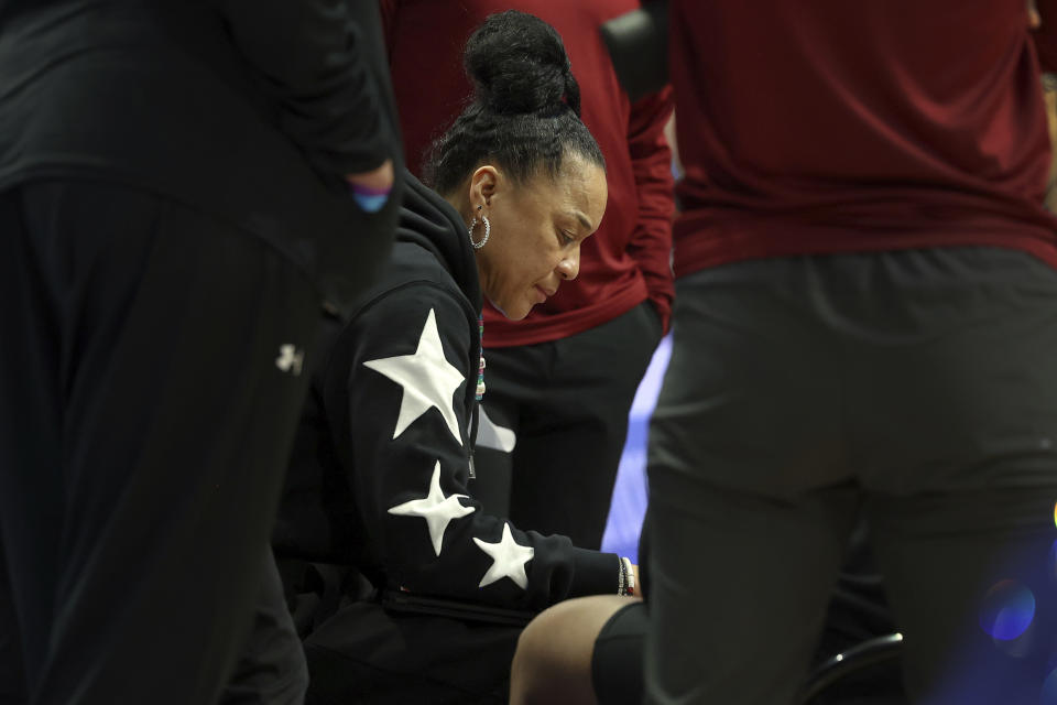 South Carolina head coach Dawn Staley draws up a play during a timeout in the first half of an NCAA college basketball game against Kentucky Sunday, Feb. 25, 2024, in Lexington, Ky. (AP Photo/James Crisp)