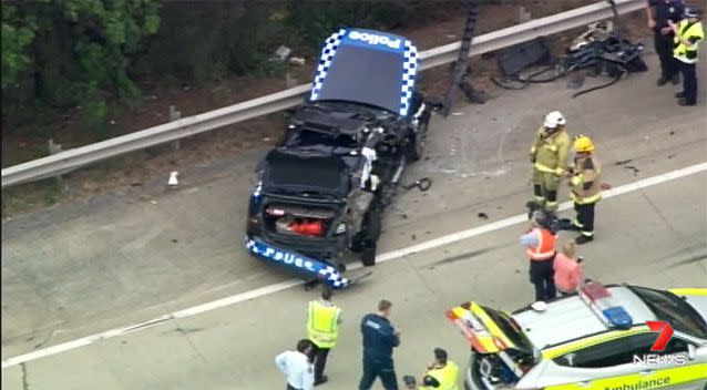 A crash has occurred on the M1 involving a truck and police car. Source: 7News