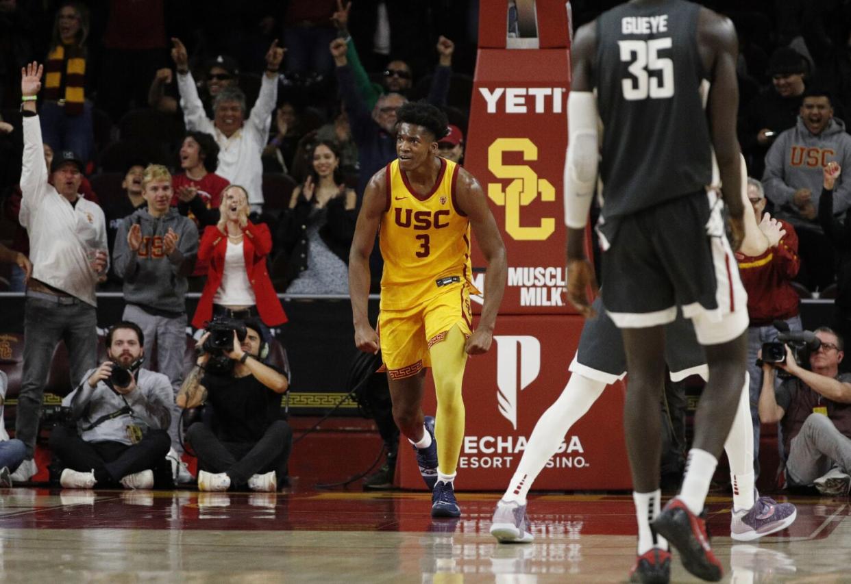 USC forward Vincent Iwuchukwu reacts after a slam dunk in the final moments of the Trojans' win over Washington State.
