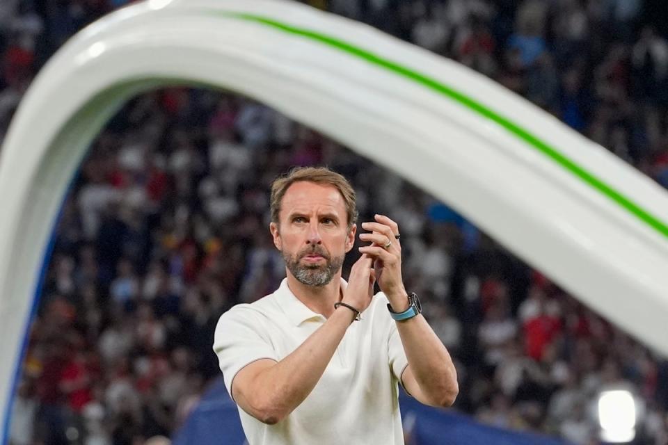 Gareth Southgate applauds England fans after the final in Berlin (AP)