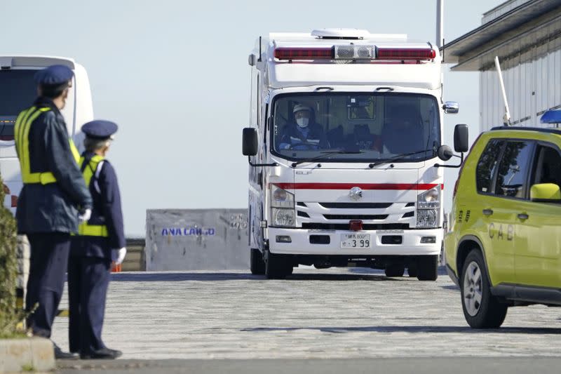 An ambulance leaves Haneda airport in Tokyo where a chartered plane carrying Japanese nationals evacuated from Wuhan landed