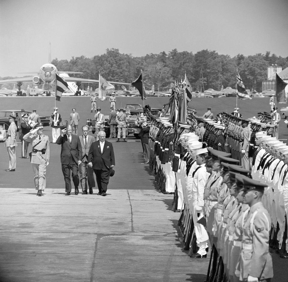 FILE - In this Sept. 15, 1959, file photo, United States President Eisenhower accompanies Soviet Premier Nikita Khrushchev as he inspects the line of honor guards at Andrews Air Force Base following his arrival. Khrushchev became the first Soviet leader to visit the U.S. (AP Photo/File)