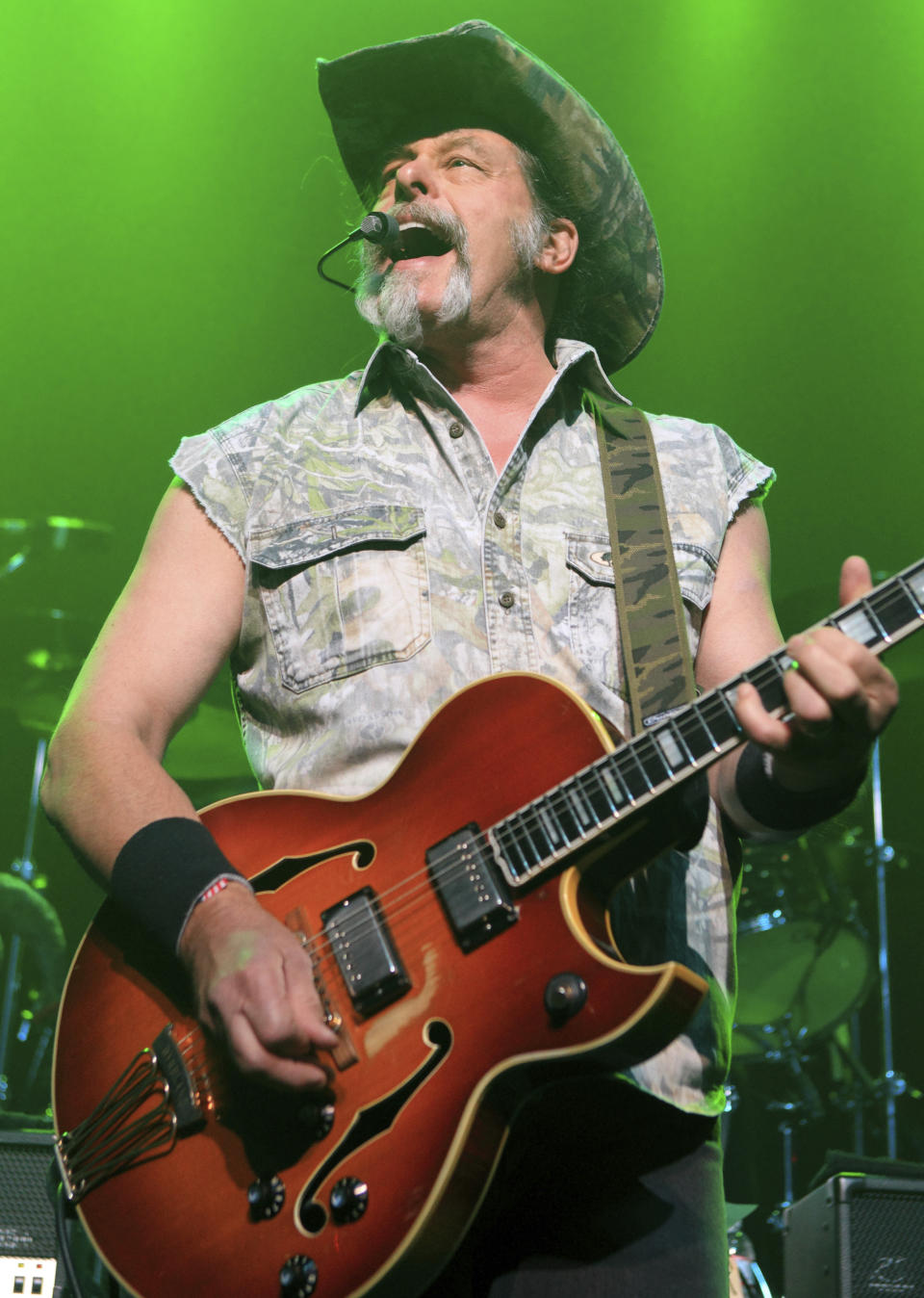 FILE - Ted Nugent performs at Rams Head Live in Baltimore on Aug. 16, 2013. Nugent revealed he was in agony after testing positive for coronavirus — months after he said the virus was “not a real pandemic.” "I thought I was dying," Nugent says in a Facebook live video posted Monday. (Photo by Owen Sweeney/Invision/AP, File)