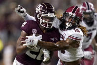 Texas A&M running back Isaiah Spiller (28) is tackled by South Carolina defensive back R.J. Roderick (10) after a short run during the first quarter of an NCAA college football game on Saturday, Oct. 23, 2021, in College Station, Texas. (AP Photo/Sam Craft)
