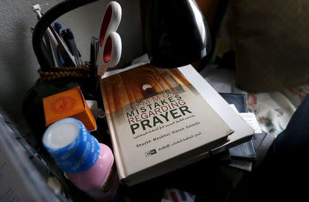 A book is shown inside the home of suspects Syed Rizwan Farook and Tashfeen Malik in Redlands, California, December 4, 2015. REUTERS/Mario Anzuoni