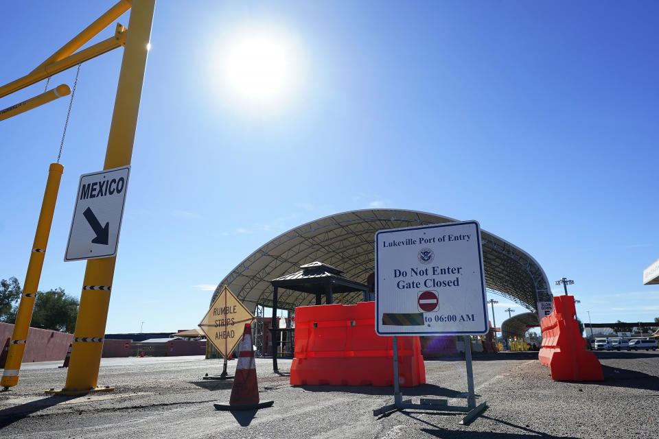 A sign shows the port of entry closed as thousands of migrants surge along the border Tuesday, Dec. 5, 2023, in Lukeville, Ariz. (AP Photo/Ross D. Franklin)